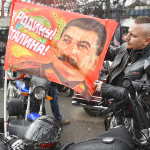 The Russian bikers' club Night Wolves starting for Berlin. The slogan on the flag reads "For Motherland! For Stalin!" This was the legendary slogan of Russian soldiers during WWII.
